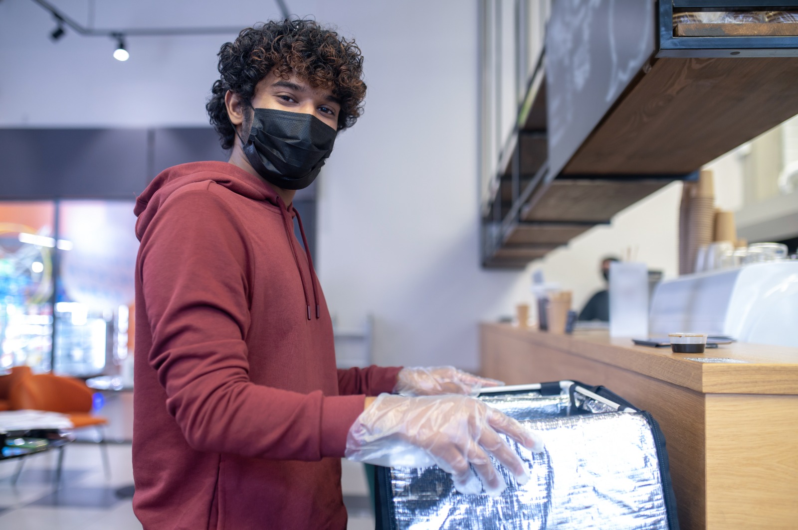 Thana Power Laundry team member ready for doorstep pickup and delivery